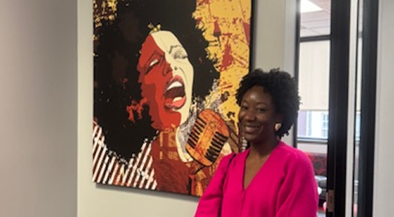 Person standing in front of a painting